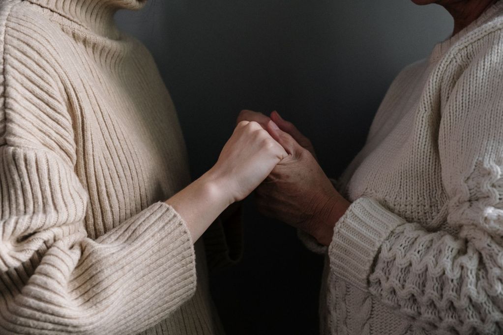 mother and daughter holding hands